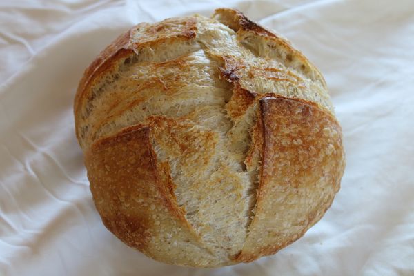 Rustic Boule On Crumpled Table Cloth